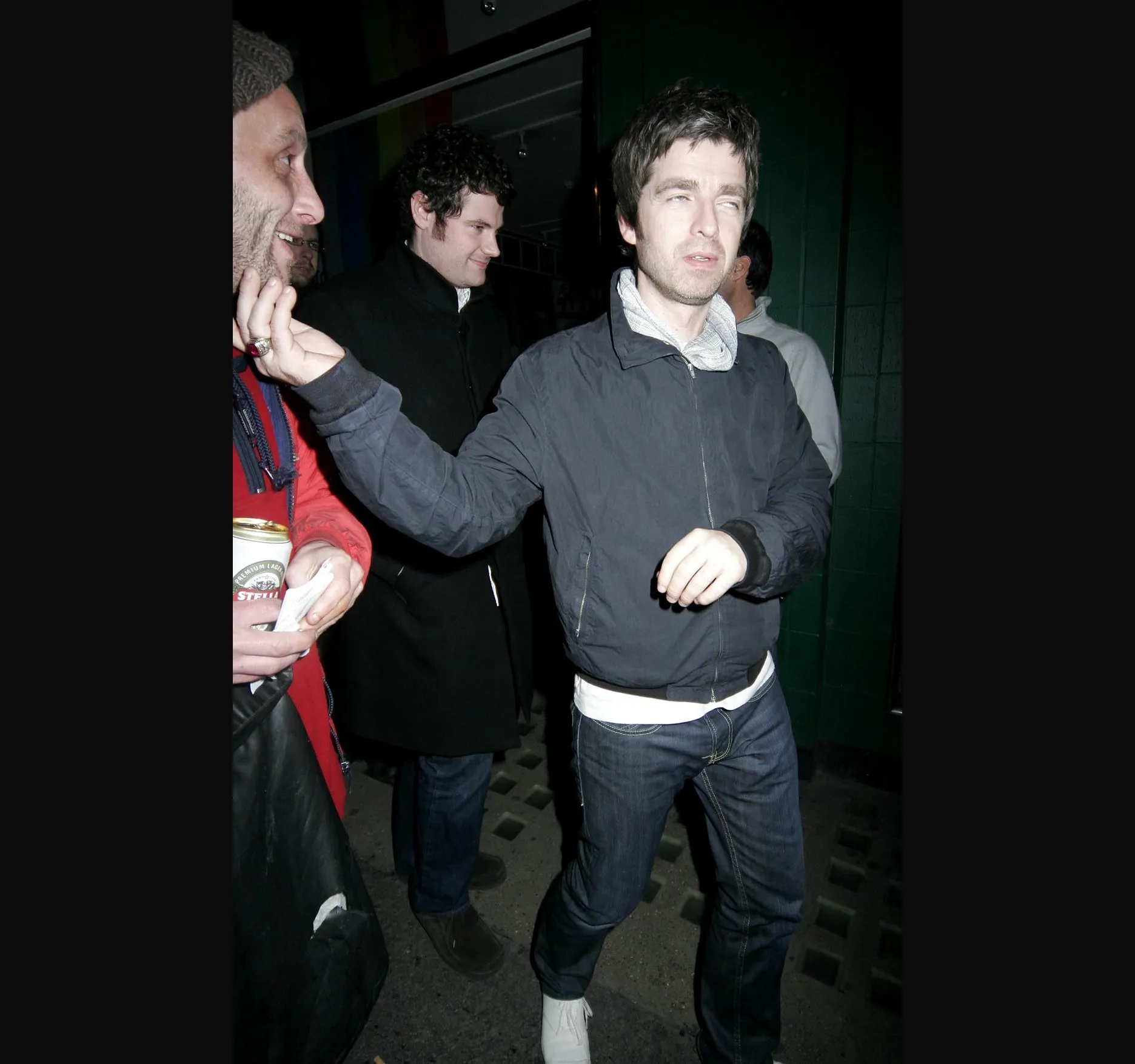SOHO, 2008. Noel Gallagher outside the Groucho Club in the early hours of 3 April 2008. Press reports at the time (Mirror, NME and Daily Star, 4 April 2008) said he had been out with Noel Fielding and James Corden after the UK premiere of the Rolling Stones film Shine a Light. I watched him hand out money to a line of beggars outside the club. That is my recollection, and I have never forgotten it.