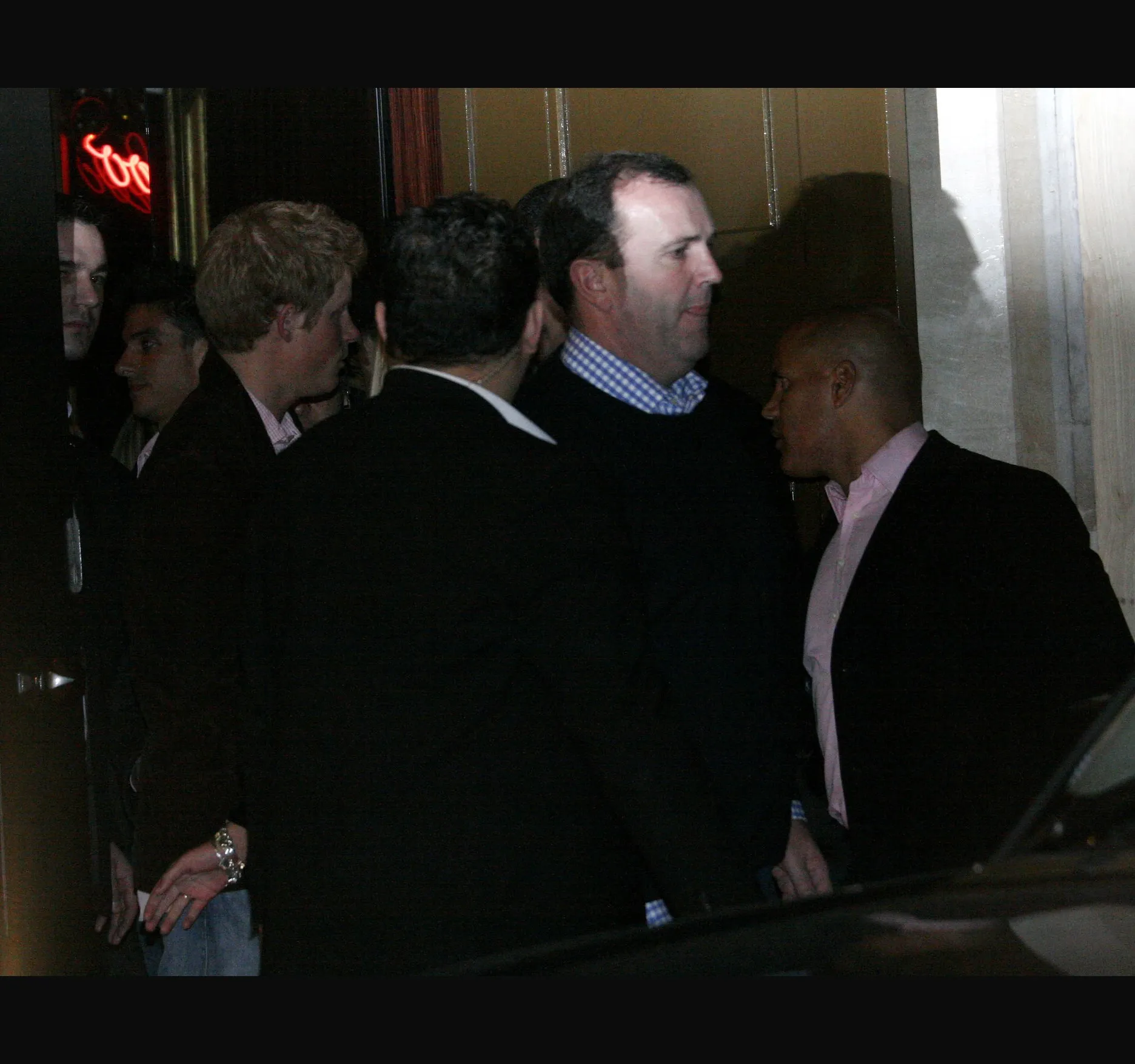 CUCKOO CLUB, JANUARY 2007. Prince Harry, then 22, leaves the Cuckoo Club in Mayfair with his then girlfriend Chelsy Davy on the night of Saturday 13 January 2007, into the early hours of 14 January.

Chelsy was visiting for ten days and Harry was on leave from his regiment. Police officers were on duty to help the couple to their car through the waiting photographers.

Here is Harry, on the left, with the group at the club door.